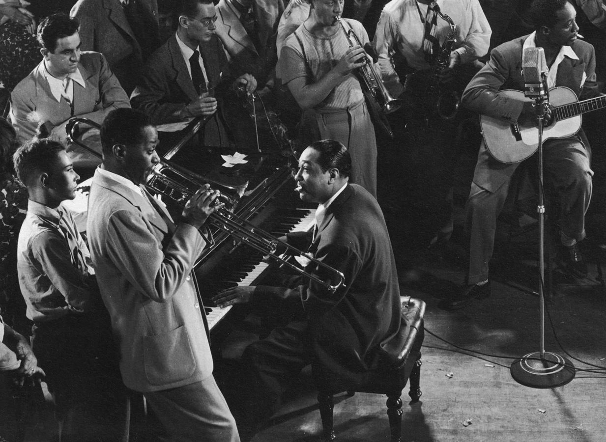 Soft light over open manuscripts on a desk, symbolizing contemplation and musical thought